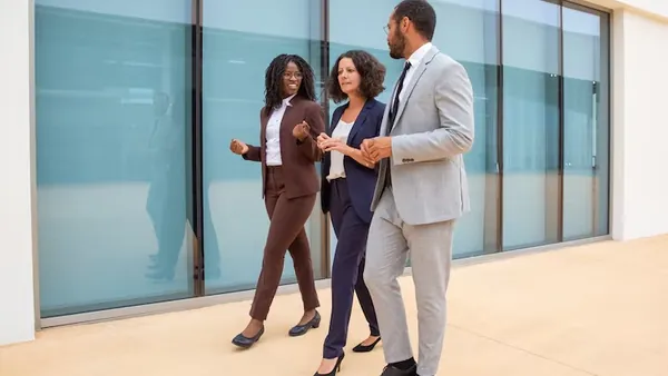 Business colleagues on a call in an office — an article about mobile apps automate business operations