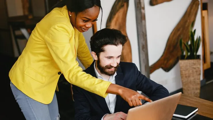 A businessman working in an office — an article about website cost in Nigeria