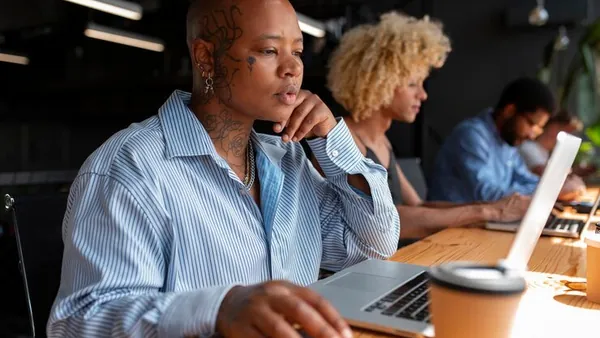 Business colleagues working in an office — an article about prepare for mobile commerce Nigeria