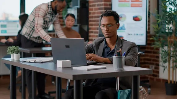 A businessman planning on a laptop in an office — how Nigerian businesses can use data to grow