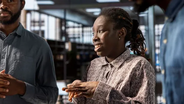 African business colleagues in a meeting in an office — an article about increase online orders restaurant Nigeria