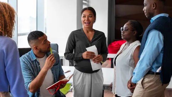 Business colleagues working in an office — an article about automate school administration in Nigeria