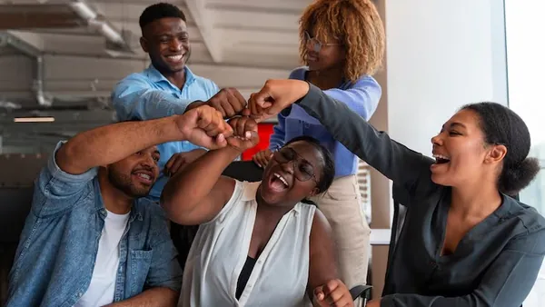 Business colleagues working in an office — an article about accept online payments on a Nigerian website