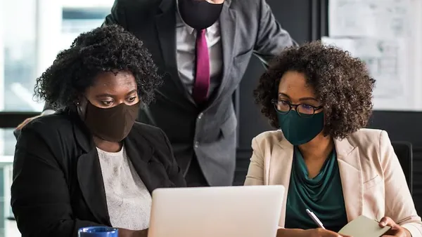 Business colleagues working in an office — how to add AI search to a business website