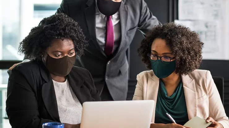 Business colleagues working in an office — how to add AI search to a business website