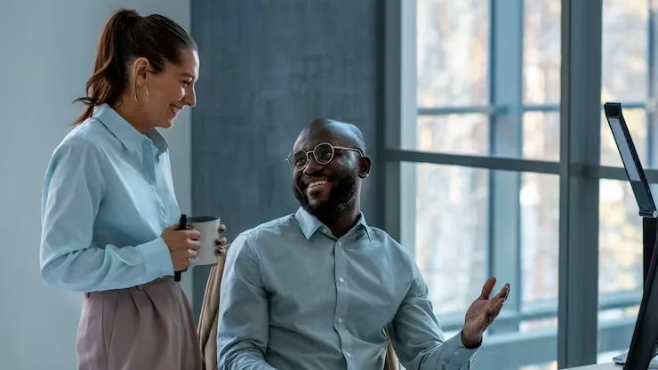 Business colleagues working in an office — how to add an AI assistant to your website