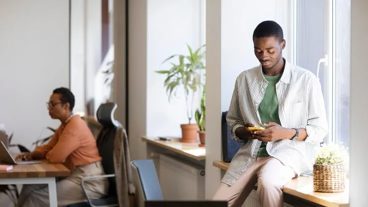 A businessman working in an office — an article about add customer accounts to your website