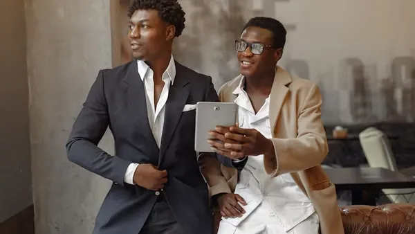 African business colleagues working in a cafe — how to automate a Nigerian business