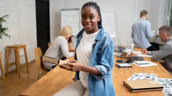 Business colleagues working in an office — how to automate e-commerce in Nigeria