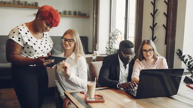 An African businessman working on a laptop in an office — how to automate lead qualification with AI