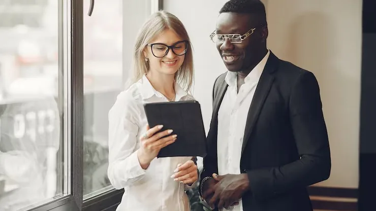 An African businessman working in an office — an article about automate sales follow-up with AI