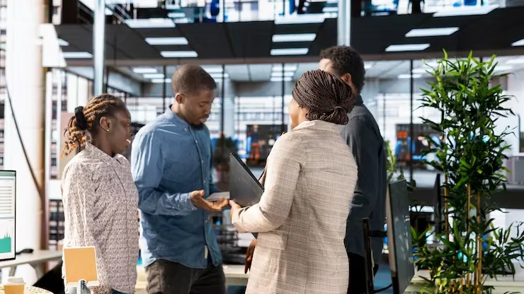 Business colleagues reviewing over documents in an office — an article about data-driven business in Nigeria