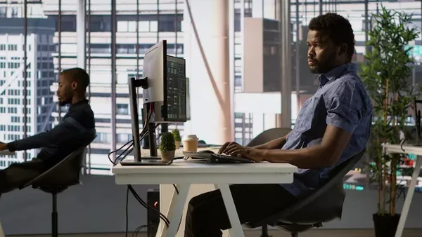 Business colleagues working in an office — how to build a delivery app in Nigeria