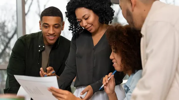 Business colleagues working in an office — an article about digital marketing funnel Nigeria