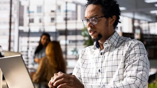 African business colleagues in a meeting in an office — how to build a fashion marketplace