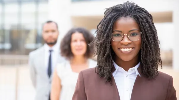 An African businesswoman working in an office — how to build a fintech app in Nigeria