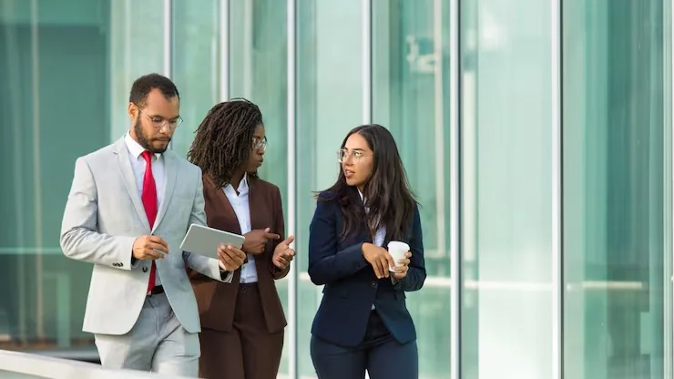 Business colleagues working in an office — how to build a hospital app in Nigeria