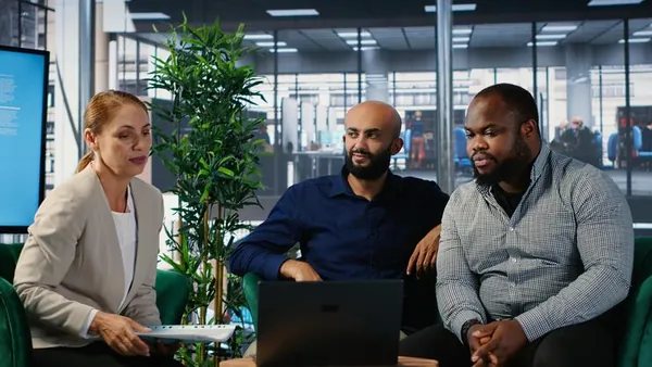 Business colleagues in a meeting in an office — how to build a marketplace app in Nigeria