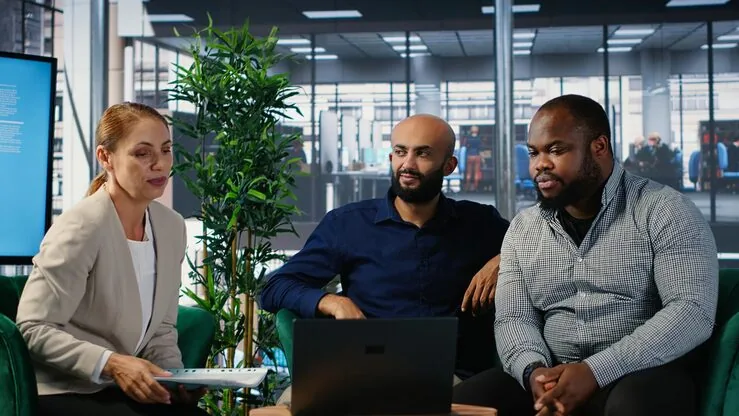 Business colleagues in a meeting in an office — how to build a marketplace app in Nigeria