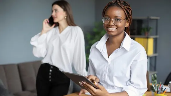 A businesswoman working in an office — how to build a marketplace startup in Nigeria