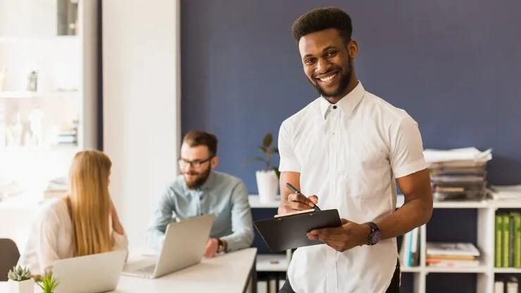 African business colleagues working in an office — an article about mobile app with camera features