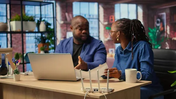 African business colleagues working in an office — an article about mobile app with subscriptions