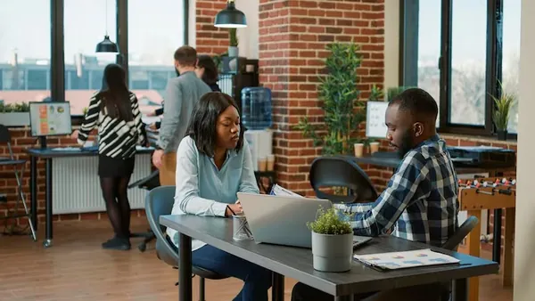 African business colleagues in a meeting in an office — an article about multi-vendor app Nigeria