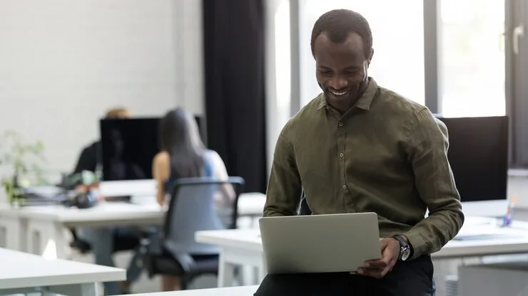 An African businessman working in an office — how to build a property listing platform in Nigeria