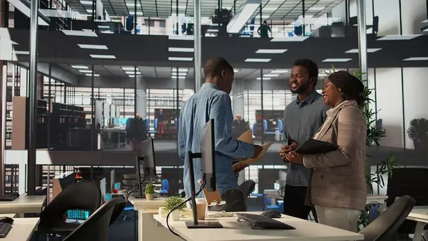 African business colleagues working in an office — how to build a SaaS business in Nigeria