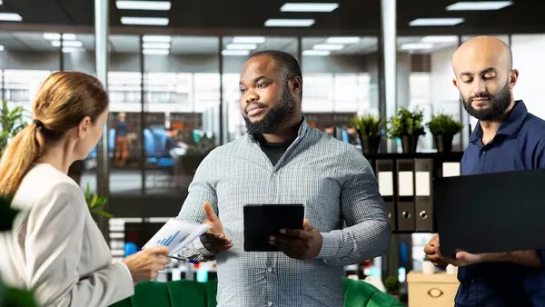 Business colleagues planning in an office — how to build a scalable business in Nigeria