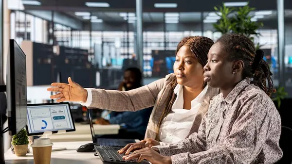 Business colleagues working in an office — an article about build a social network app in Nigeria
