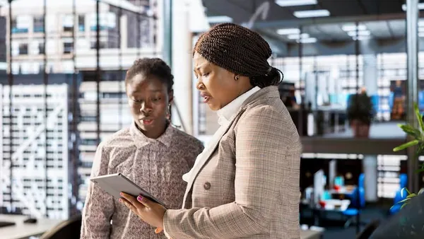 African business colleagues planning in an office — how to build a subscription business in Nigeria