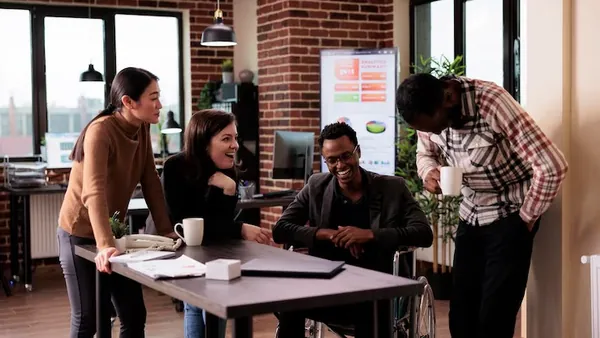 Business colleagues on a call in an office — how to build a taxi app in Nigeria
