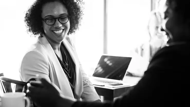 Business colleagues in a meeting in a cafe — an article about AI document assistant