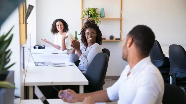 Business colleagues working in an office — how to build an e-commerce app in Nigeria