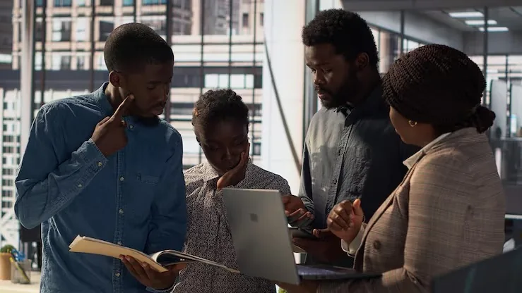 Business colleagues working in an office — how to build an MVP for an online business