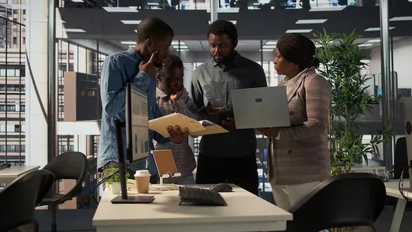 Business colleagues working in an office — how to build an MVP in Nigeria