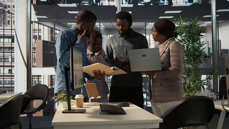 Business colleagues working in an office — how to build an MVP in Nigeria