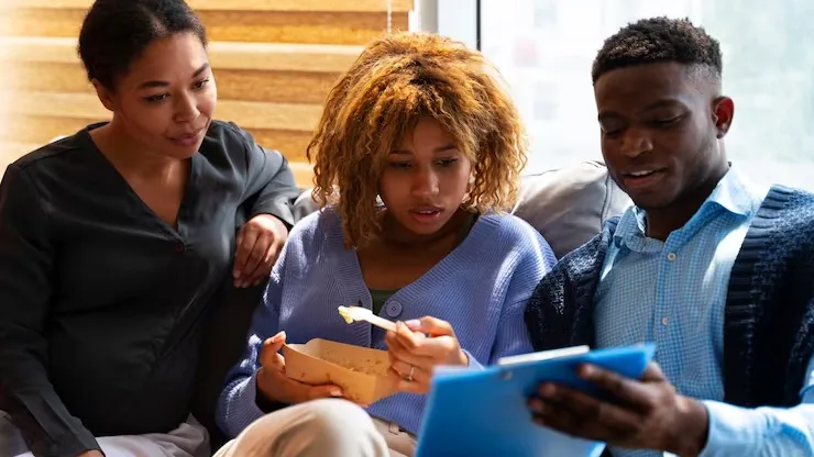 Business colleagues working in an office — how to build an online food ordering platform