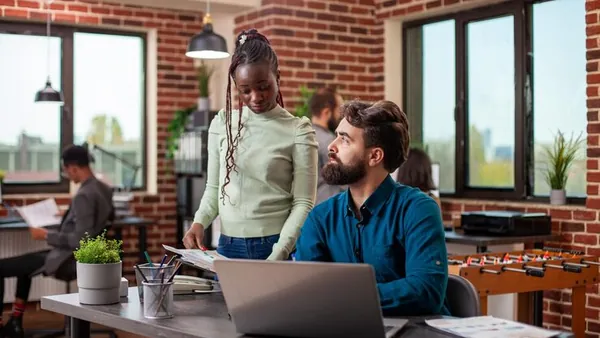 An African businesswoman working in an office — how to build customer loyalty in Nigeria