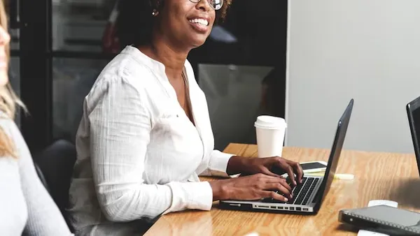 Business colleagues in a meeting in an office — how to choose a website development company in Nigeria