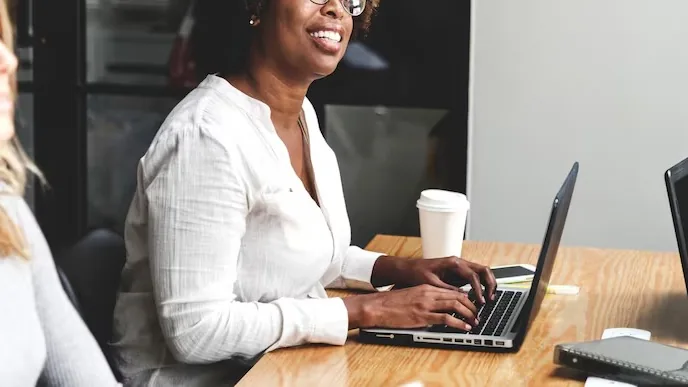 Business colleagues in a meeting in an office — how to choose a website development company in Nigeria