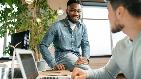 Business colleagues in a meeting in an office — how to choose an app development company in Nigeria