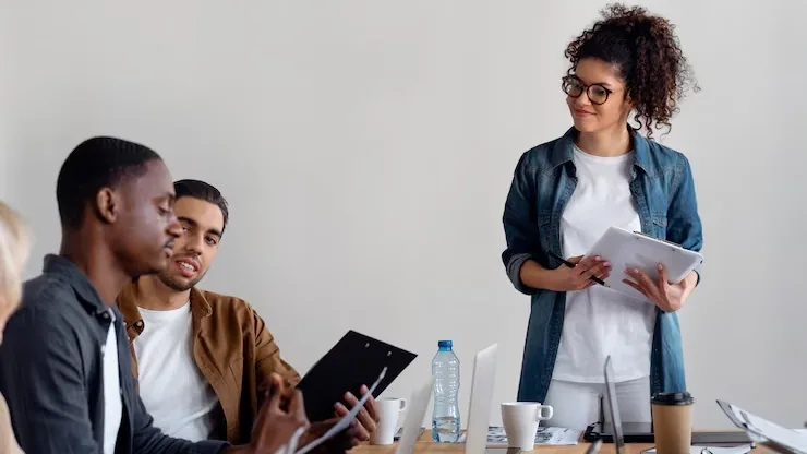 Business colleagues working in an office — an article about connect AI to WhatsApp