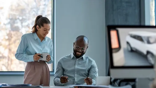 Business colleagues working in an office — an article about connect WhatsApp to CRM