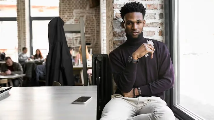 A businessman working with a tablet in an office — how to create a digital customer journey