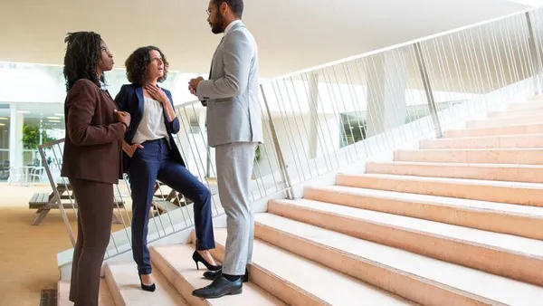 Business colleagues working in an office — how to digitise a Nigerian business