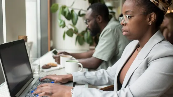 Business colleagues working in an office — how to generate leads online in Nigeria