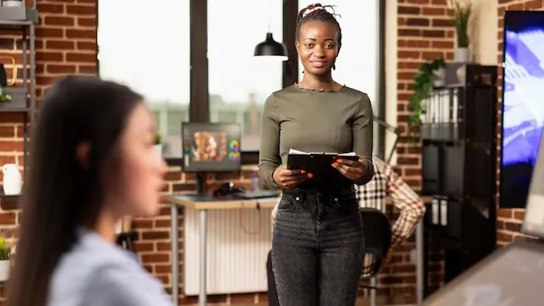 A businesswoman at work in an office — how to get more customers online in Nigeria
