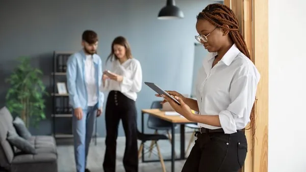 A businesswoman working in an office — how to increase online sales in Nigeria